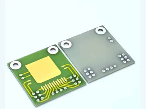 View 1: Paired AlN thick film PCB front and rear views with gold-colored routing and ringed openings