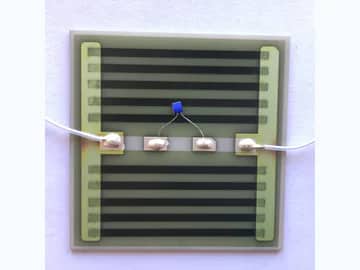 View 4: Single wired AlN thick film heater showing parallel printed tracks, terminal joints, and a small sensor