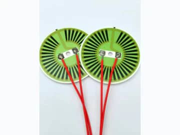 View 4: Supplied alternate-angle group view of round alumina ceramic heater discs and their visible printed patterns