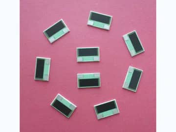 View 2: Group of small rectangular thick film power resistors with dark films and opposing terminal areas