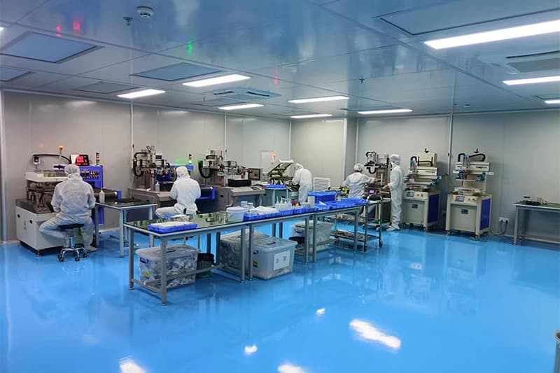 Chipsimple screen-printing workshop with operators and multiple printing stations