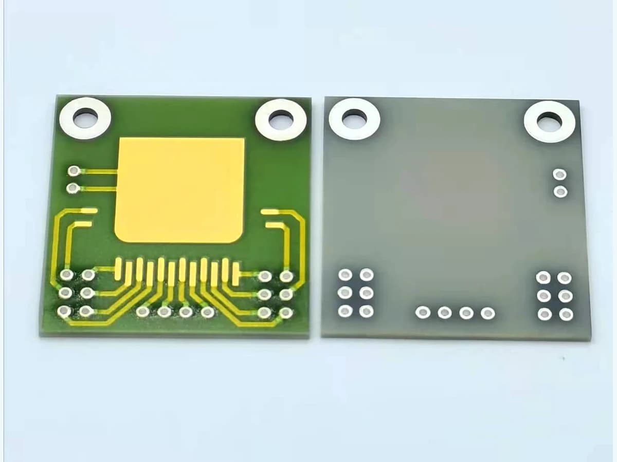 Real aluminum nitride circuit samples with visible gold-colored printed features on front and back faces