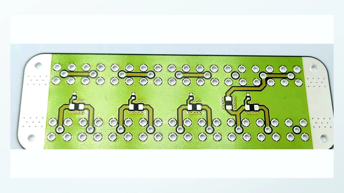 Real ceramic circuit face with fired conductors, resistor features, pads, and edge details