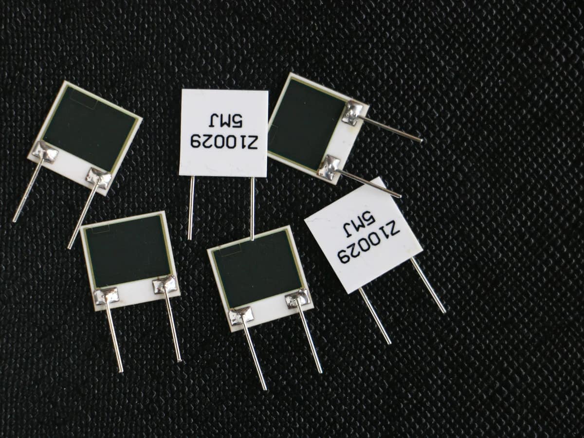 Controlled detail crop of a verified custom thick film resistor network showing printed elements, terminals, and identification labels