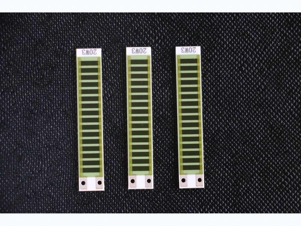 Real ceramic thick film resistor-network parts with repeated printed resistor geometries