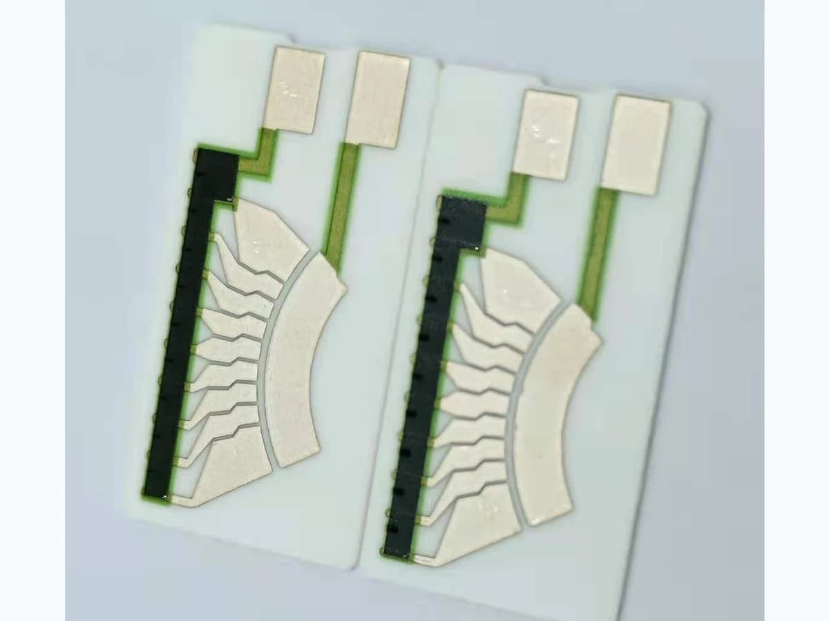 Ceramic arc-track reference samples with segmented metal-colored regions and printed surface routes