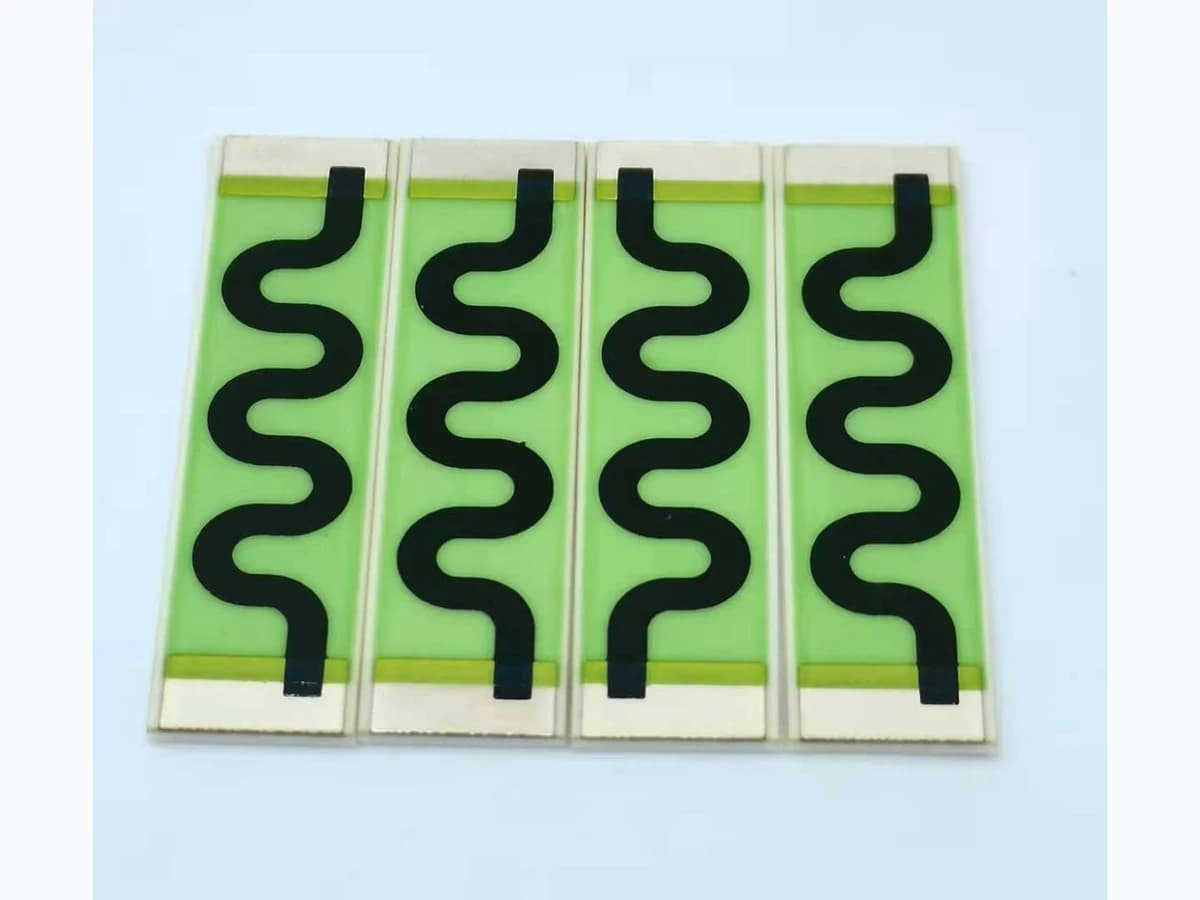 Real elongated thick-film resistor products with visible resistive paths and terminal regions