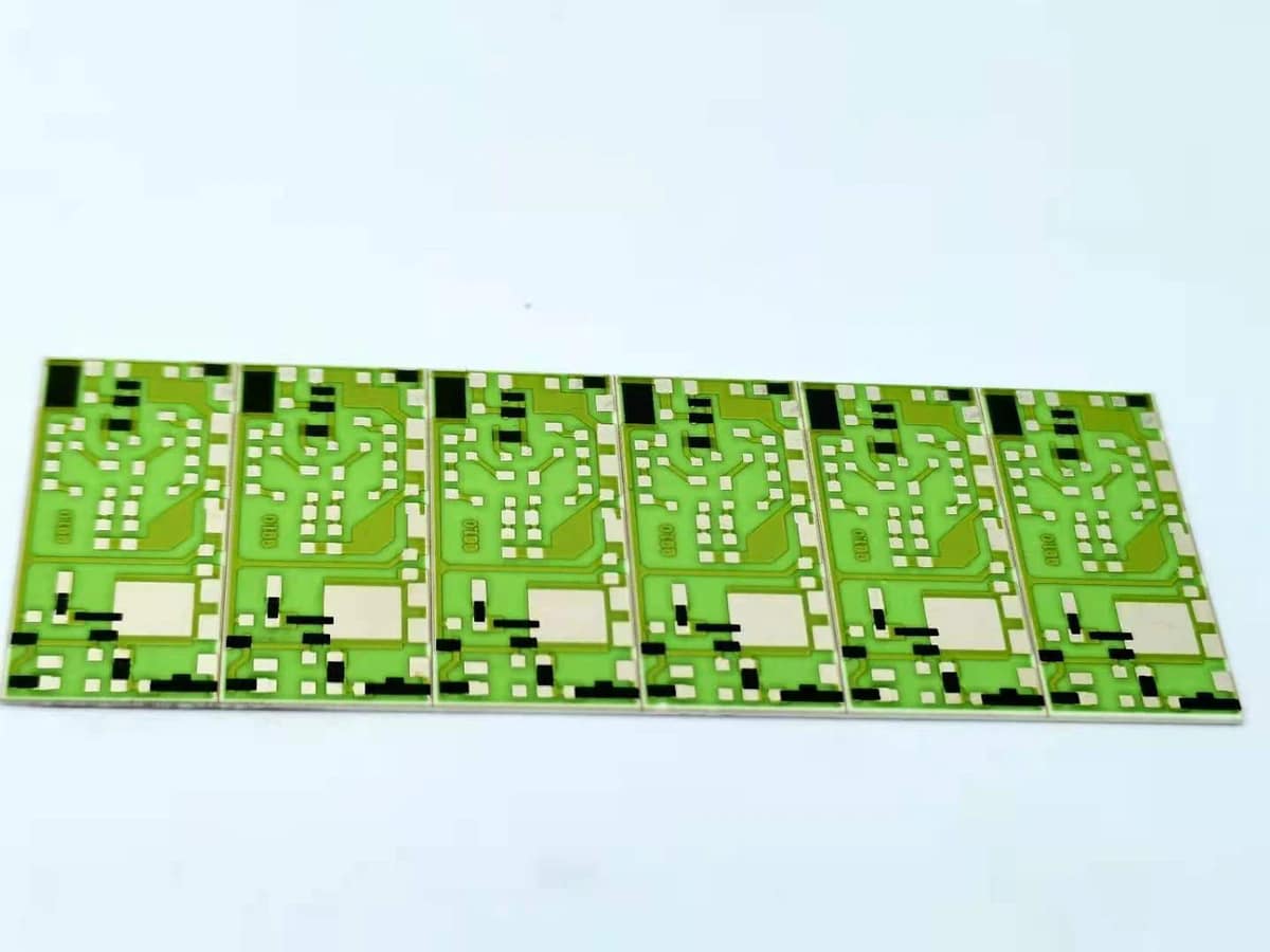 Panel of green ceramic printed thick film resistors with repeated conductor and resistor layouts
