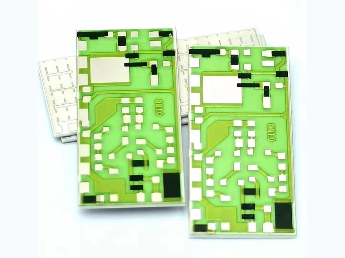 Real printed thick film resistor products on ceramic substrates with visible resistor and terminal geometry