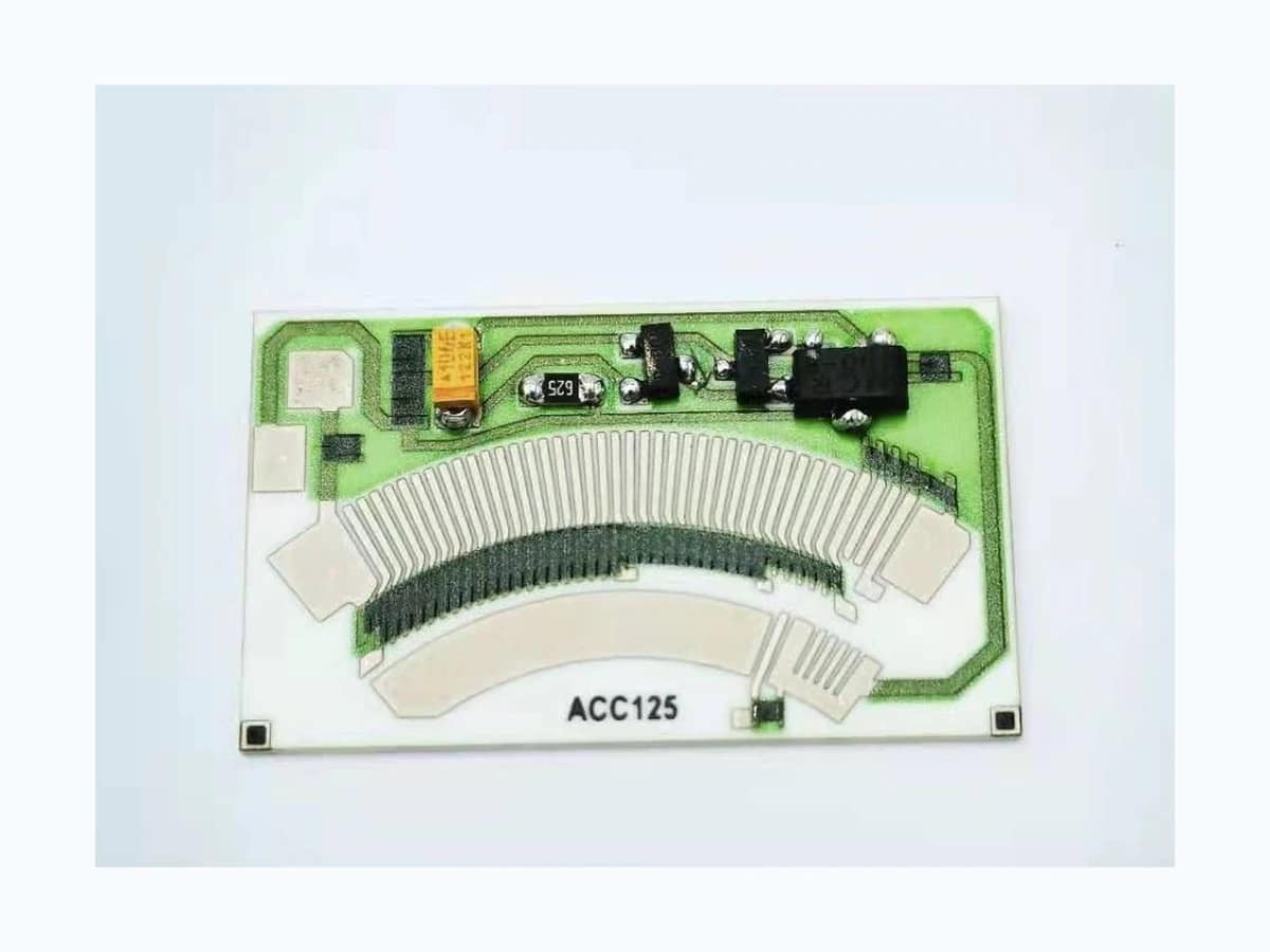 Complete rotary position sensor resistor card with populated components and printed arc tracks