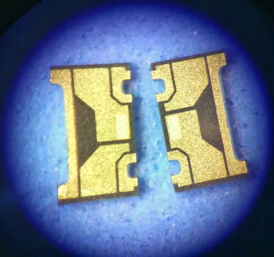 Two shaped company thin film circuit samples with side notches and patterned contact regions