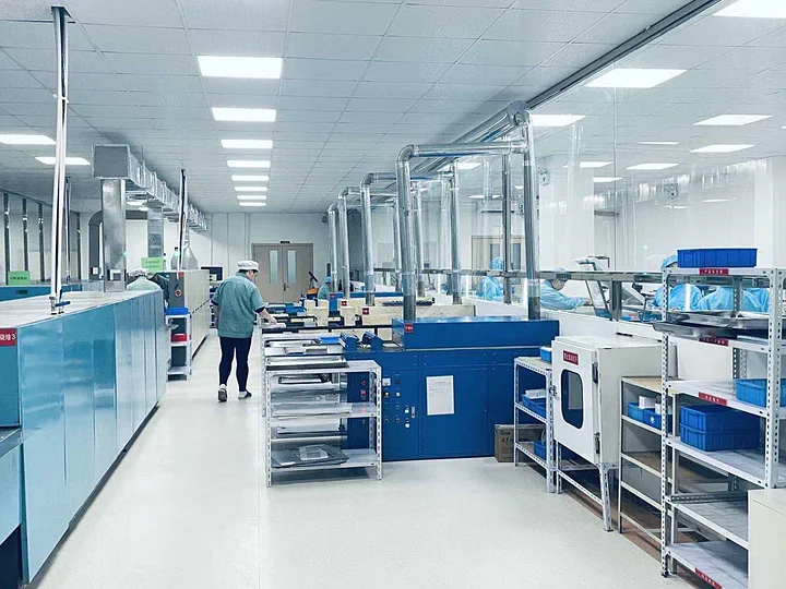 Company production floor with enclosed equipment and material carts