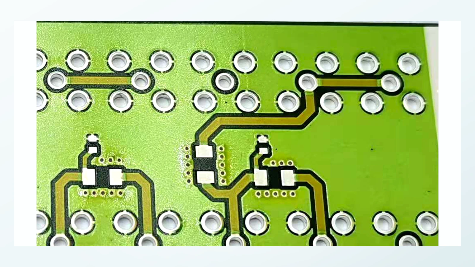 Close real product view showing repeated apertures, metal-colored rings, and printed routing