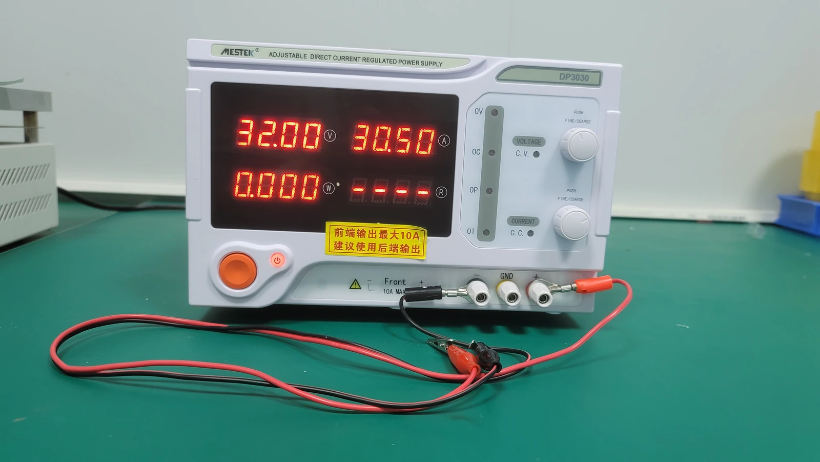 A bench DC power supply with separate current and voltage controls for selecting the drive condition.