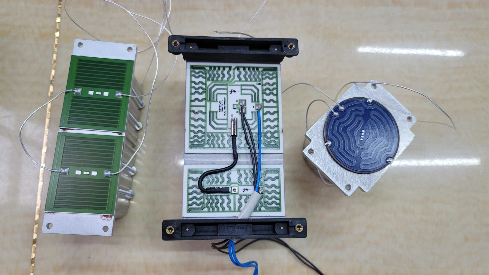 Different heater geometries photographed together. Active resistive area must not be confused with total component footprint.