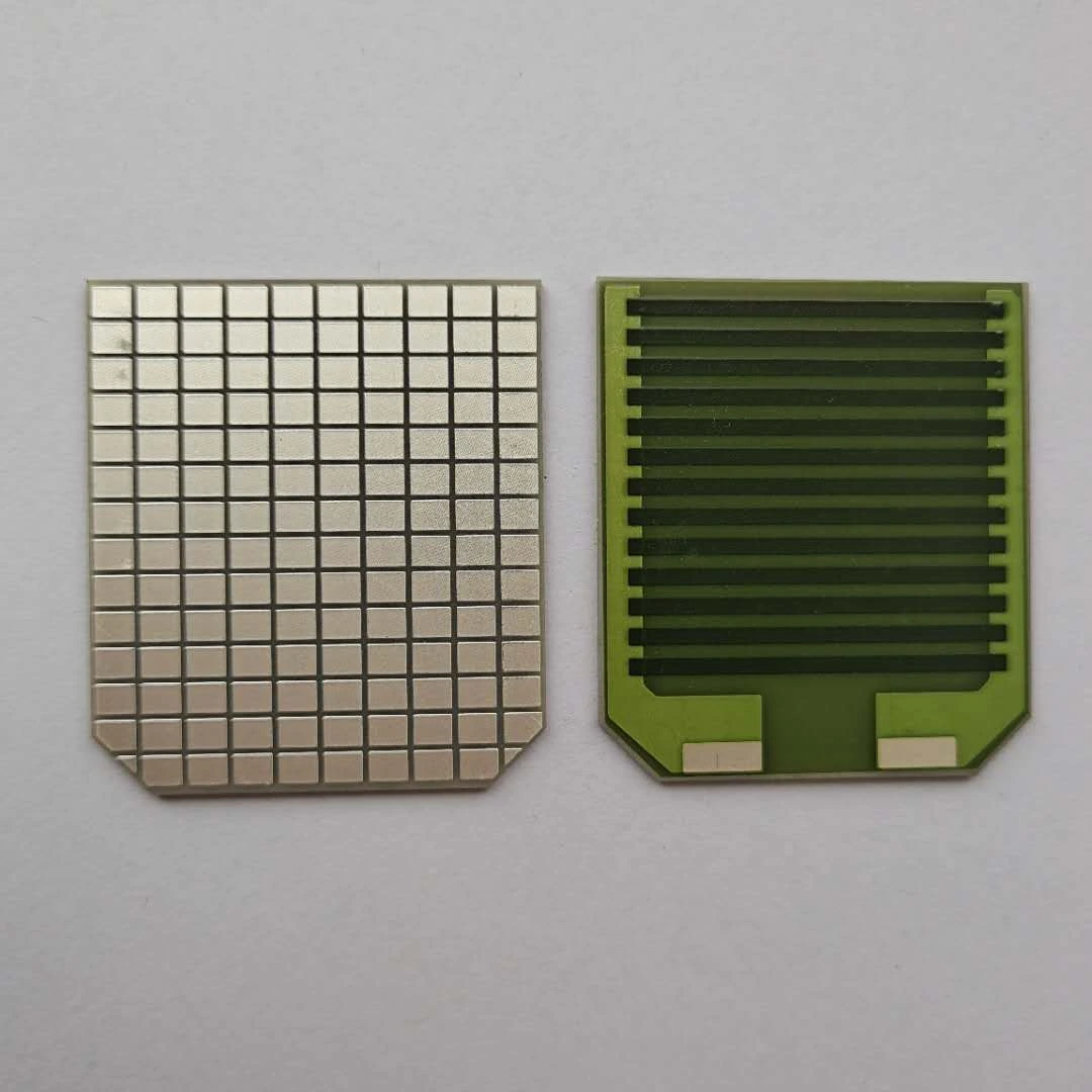 Parallel resistive paths and connection pads on a coated ceramic element, showing how routing density changes the available area.
