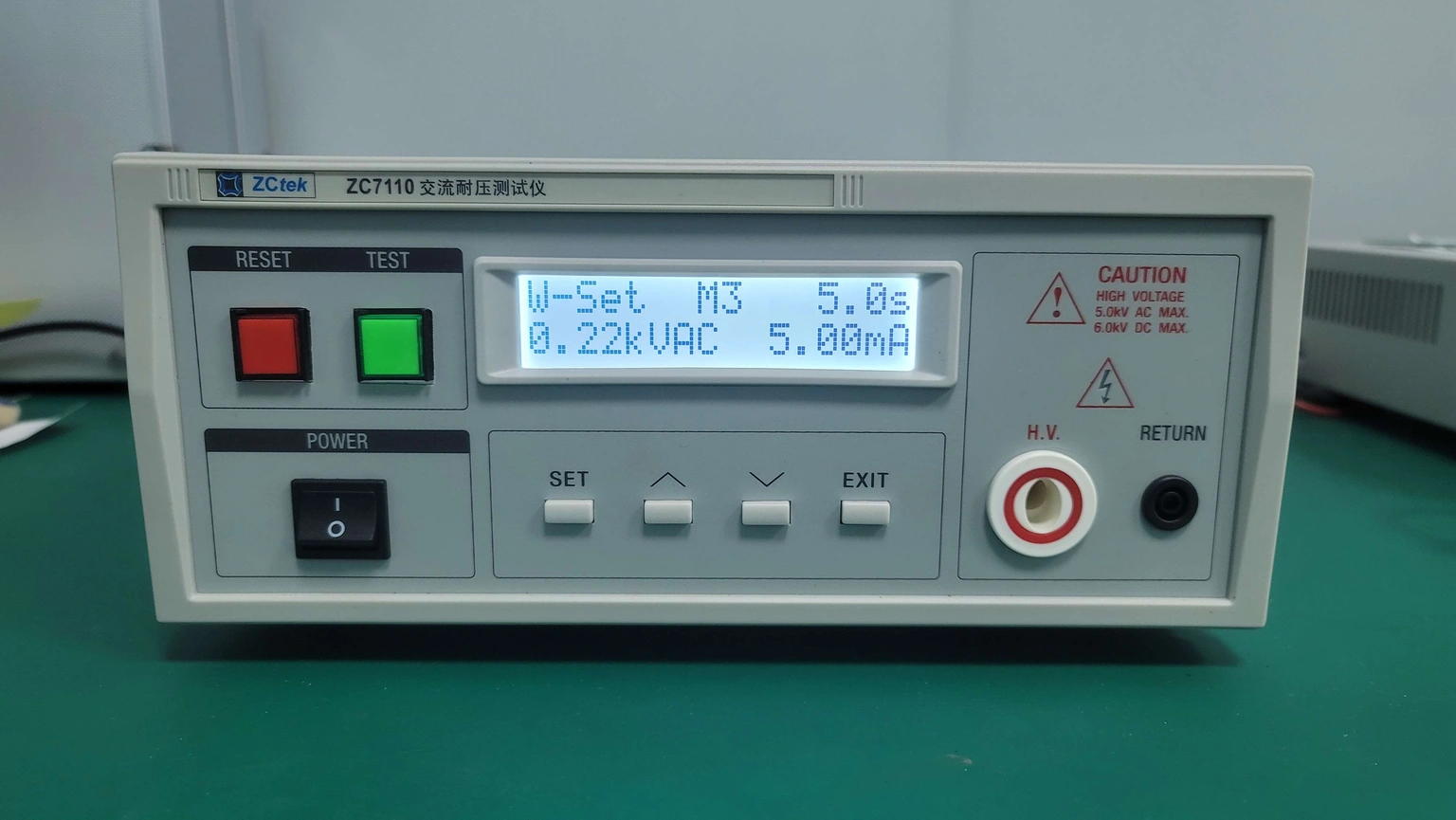 An AC withstand tester on its setup screen, with high-voltage and return sockets unconnected.