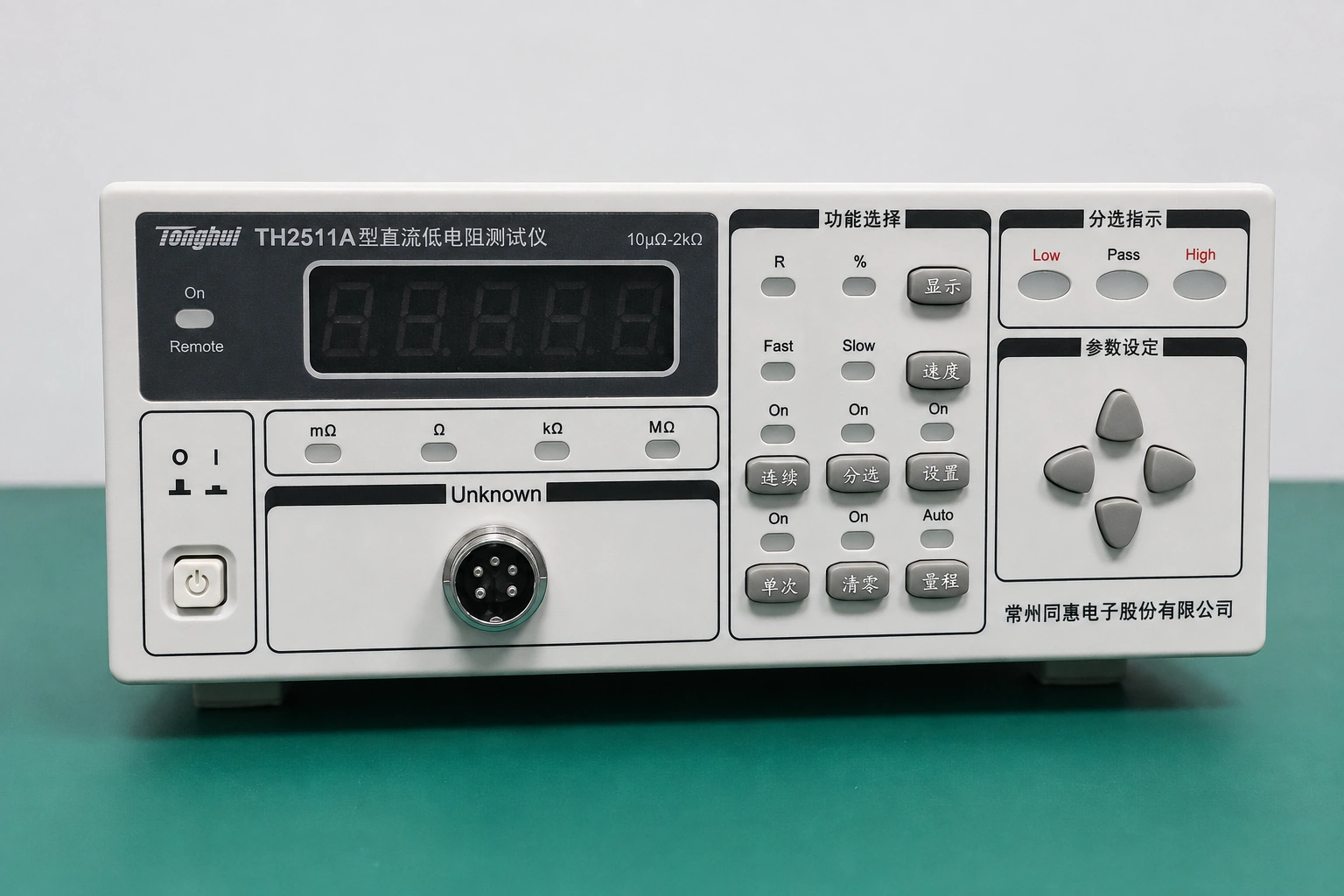 A DC low-resistance meter with inactive display and status lamps, and its front specimen connector unconnected.