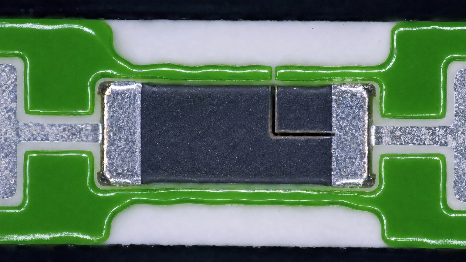 High-resolution industrial engineering scene showing trim kerf inspection in a clean thick-film ceramic circuit context.