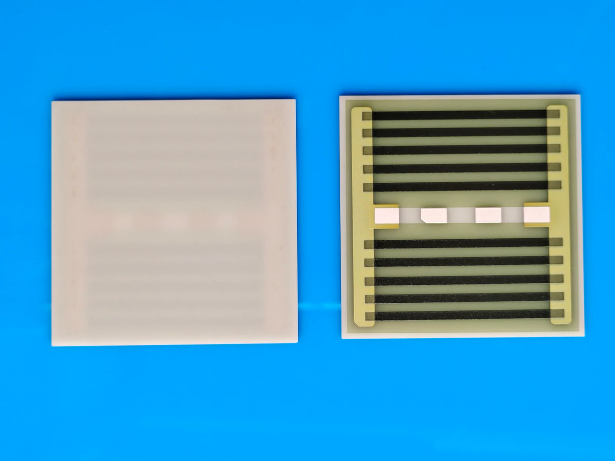 Controlled detail crop of a verified AlN thick film heater showing printed resistance paths and terminal pads