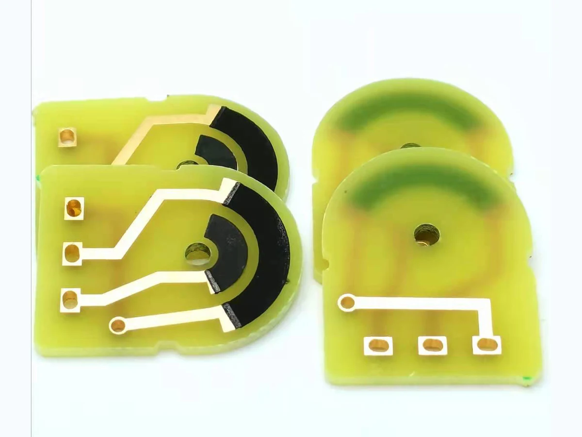 Carbon film potentiometer PCB samples with arc-shaped black resistive tracks and conductor pads