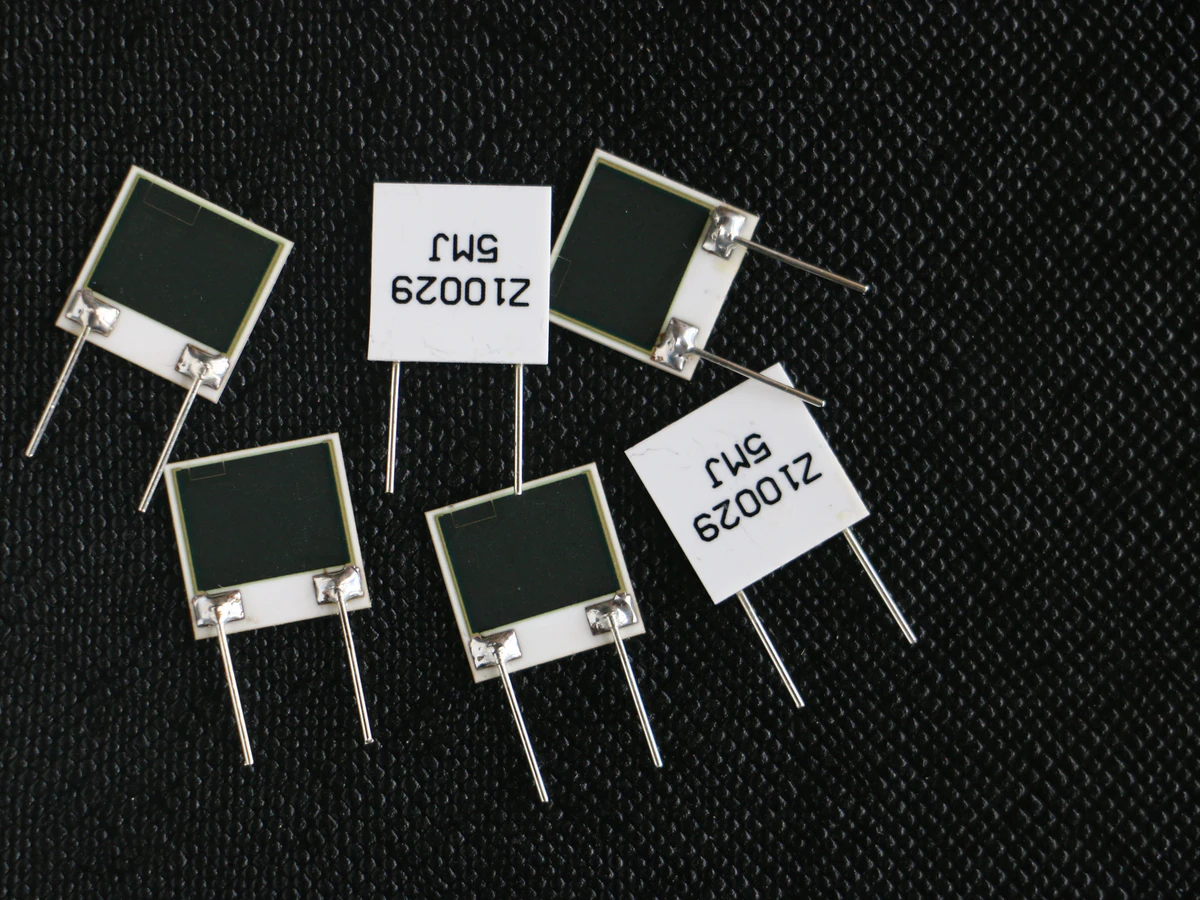 Controlled detail crop of a verified custom thick film resistor network showing printed elements, terminals, and identification labels