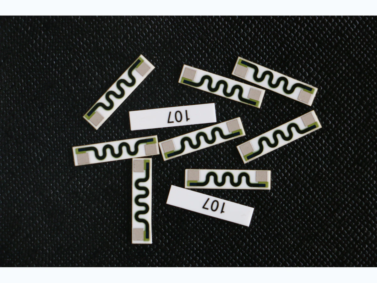 Real ceramic thick film resistor-network samples showing conductor and resistor layers