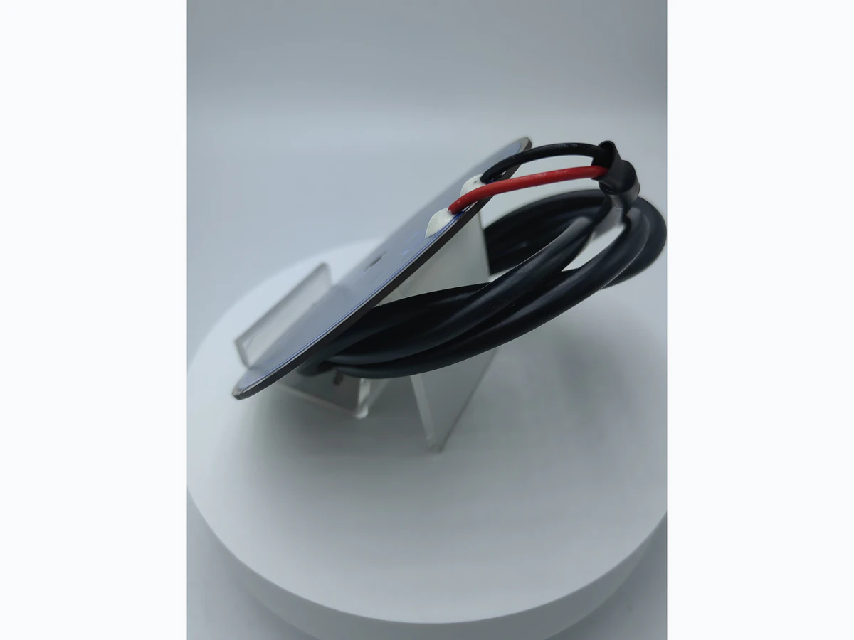 Supplied side and rear photograph showing kettle heater leads, joined terminals, plate edge, and support features