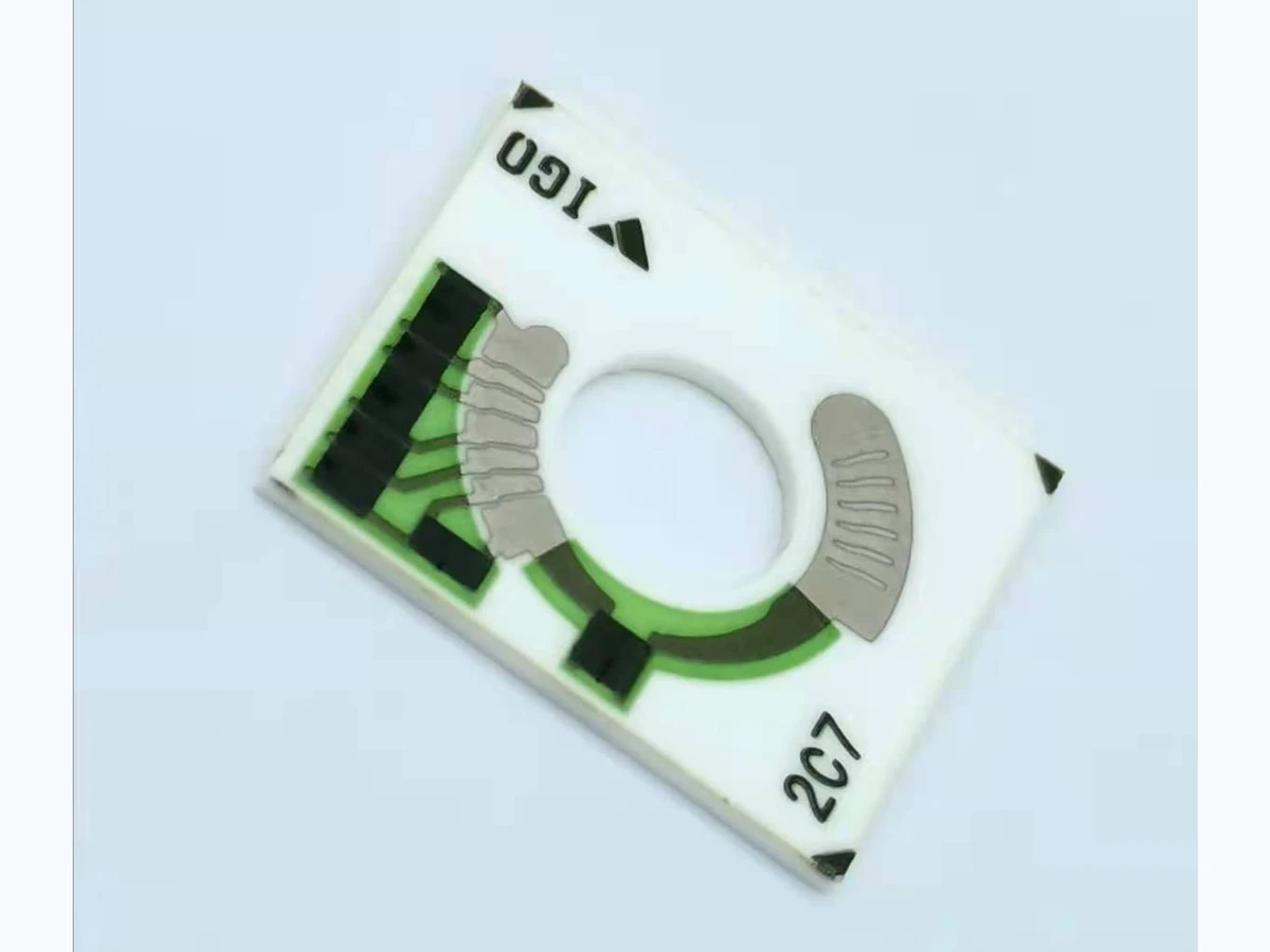 Verified complete motorcycle fuel gauge resistor card with central opening and printed arc tracks