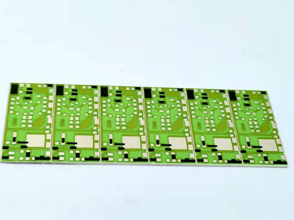 Panel of green ceramic printed thick film resistors with repeated conductor and resistor layouts