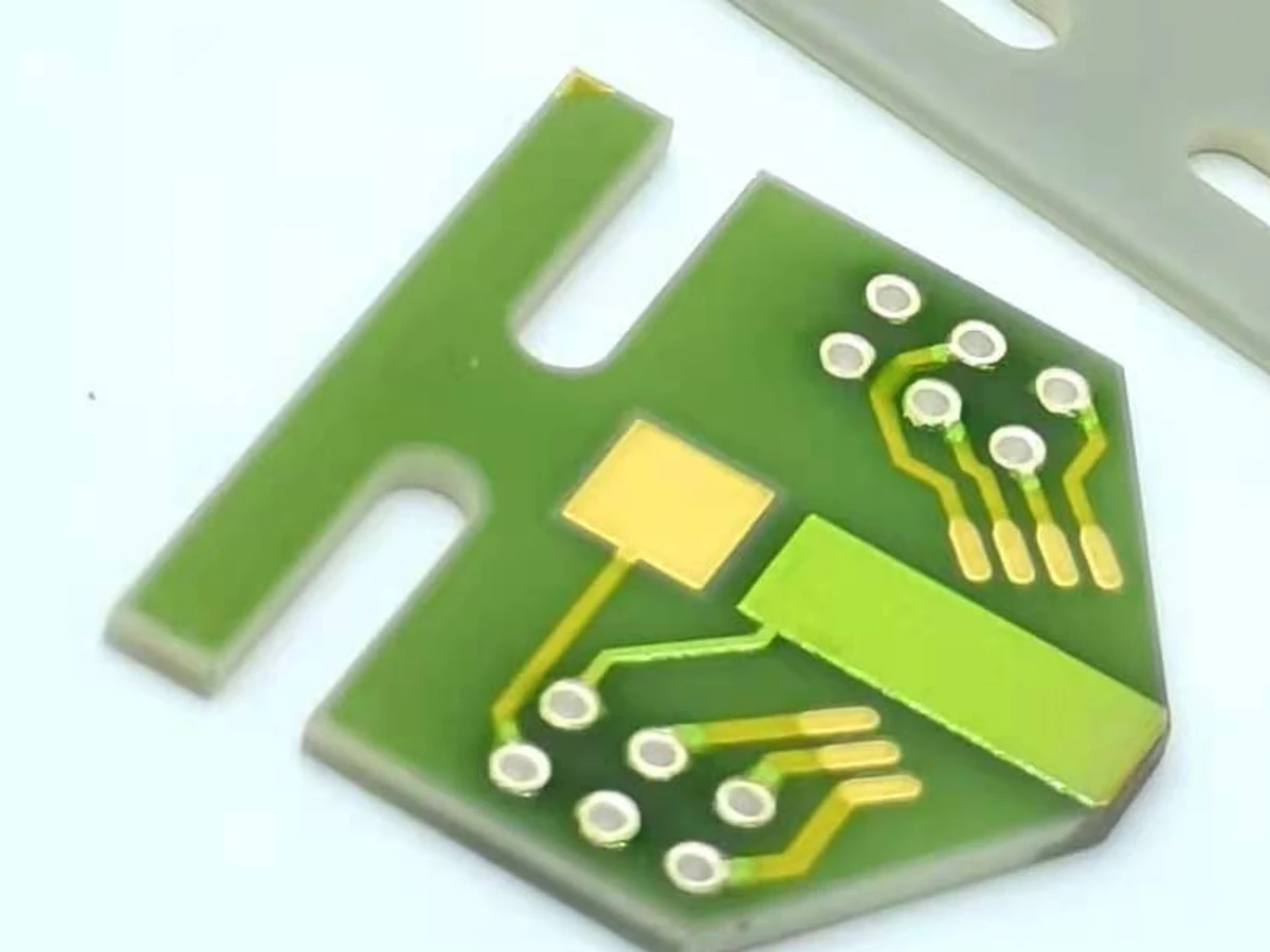 Close ceramic circuit view showing surface rings, apertures, and printed routes without exposing hole walls