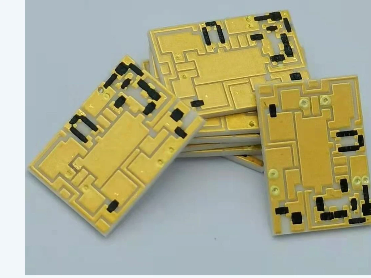 Verified group view of thick film filter circuits with multiple visible routing patterns and dark functional areas