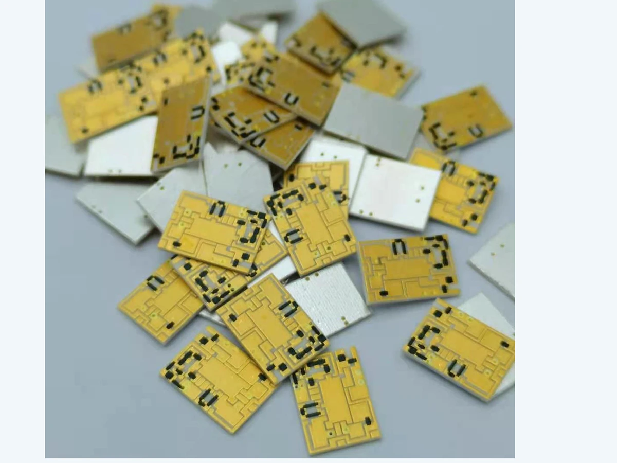 Verified batch view of thick film filter circuit samples with patterned and plain ceramic faces visible